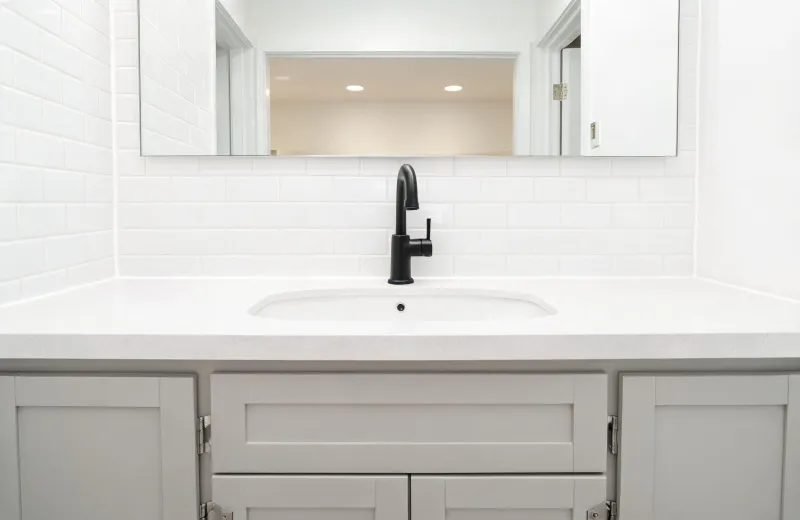 Multifamily apartment bathroom vanity with Delta lavatory faucet